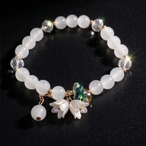 Elegant White Beaded Charm Bracelet with Floral Accents